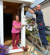 Care & Repair small repairs service customer Margaret Williams with handyman John Magee